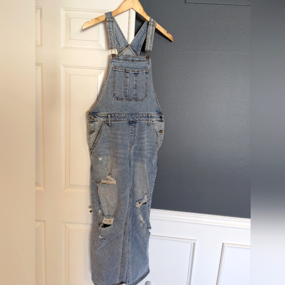 Light wash distressed denim overalls